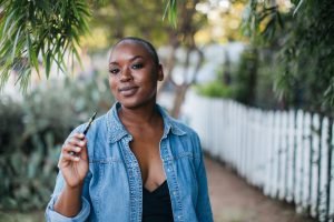 Woman vaping using a Juul product