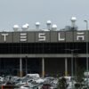 A general view shows the Tesla logo on the Gigafactory in Gruenheide near Berlin, Germany, August 30, 2022. REUTERS/Annegret Hilse/File Photo