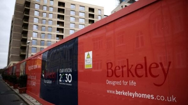 Hoardings display a logo of Berkeley Group outside a development in London, Britain, March 4, 2023. REUTERS/Henry Nicholls/File Photo